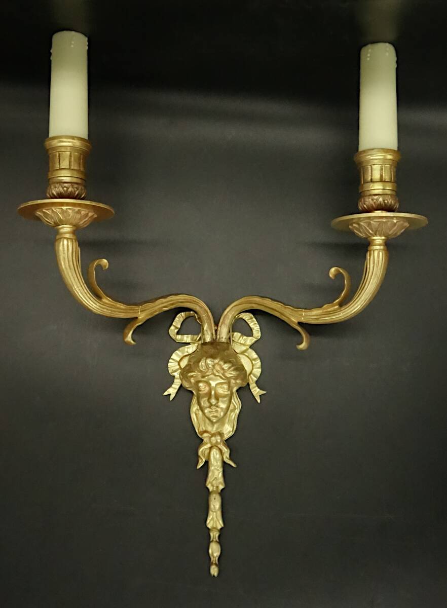 Pair of large Louis XVI style sconces with male faces - bronze