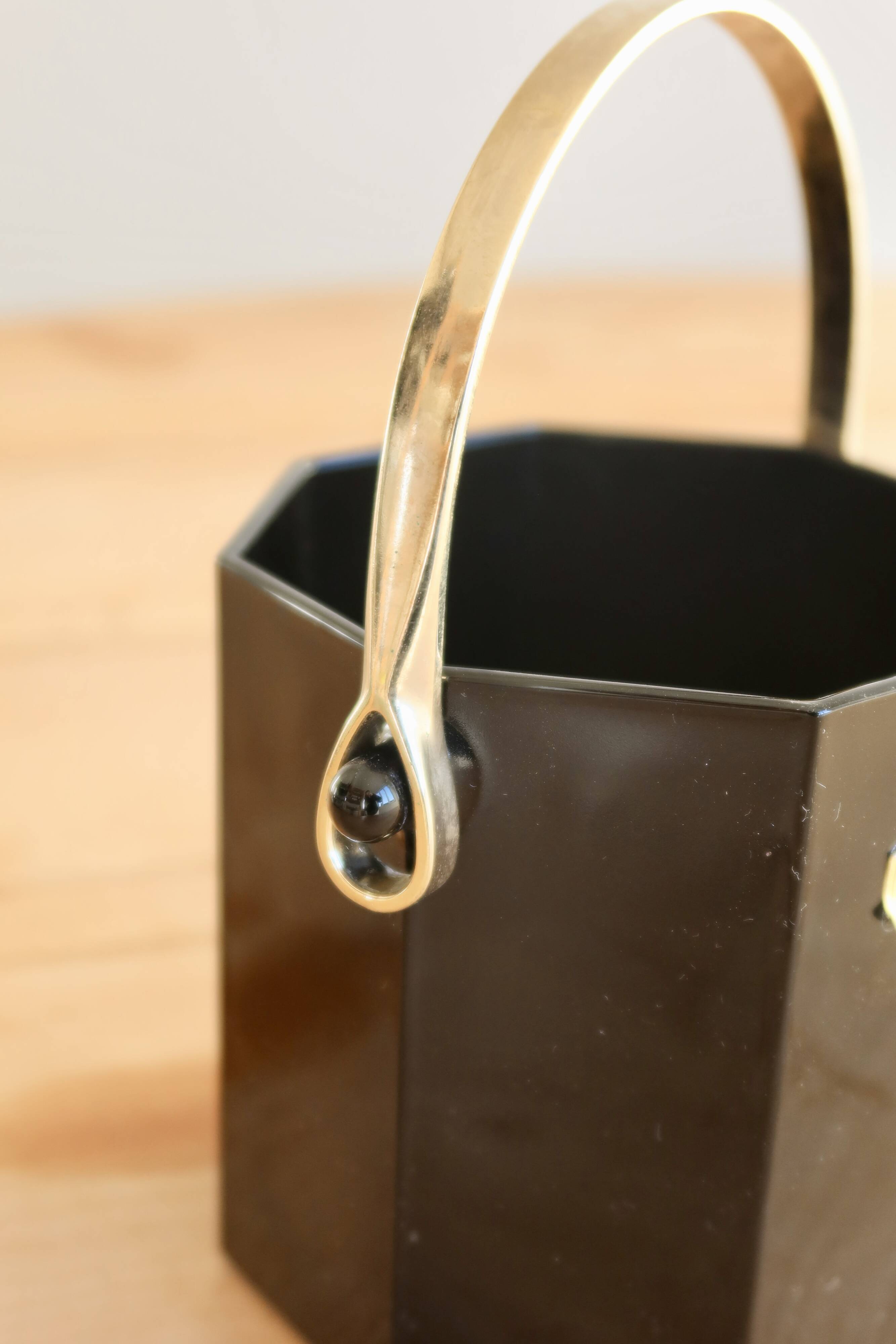 Vintage Luminarc ice bucket, black glass with a gold metal handle.