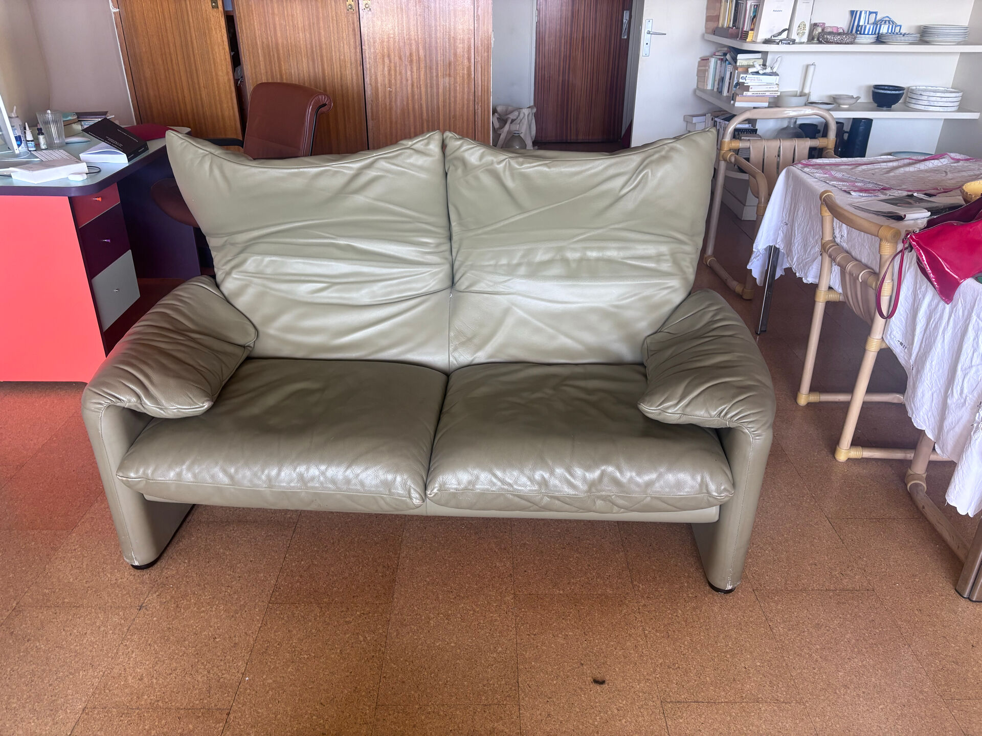 Two-seater Maralunga sofa in olive green leather.