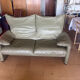 Two-seater Maralunga sofa in olive green leather.
