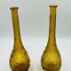 Set of two vintage textured amber glass Empoli bottles.
