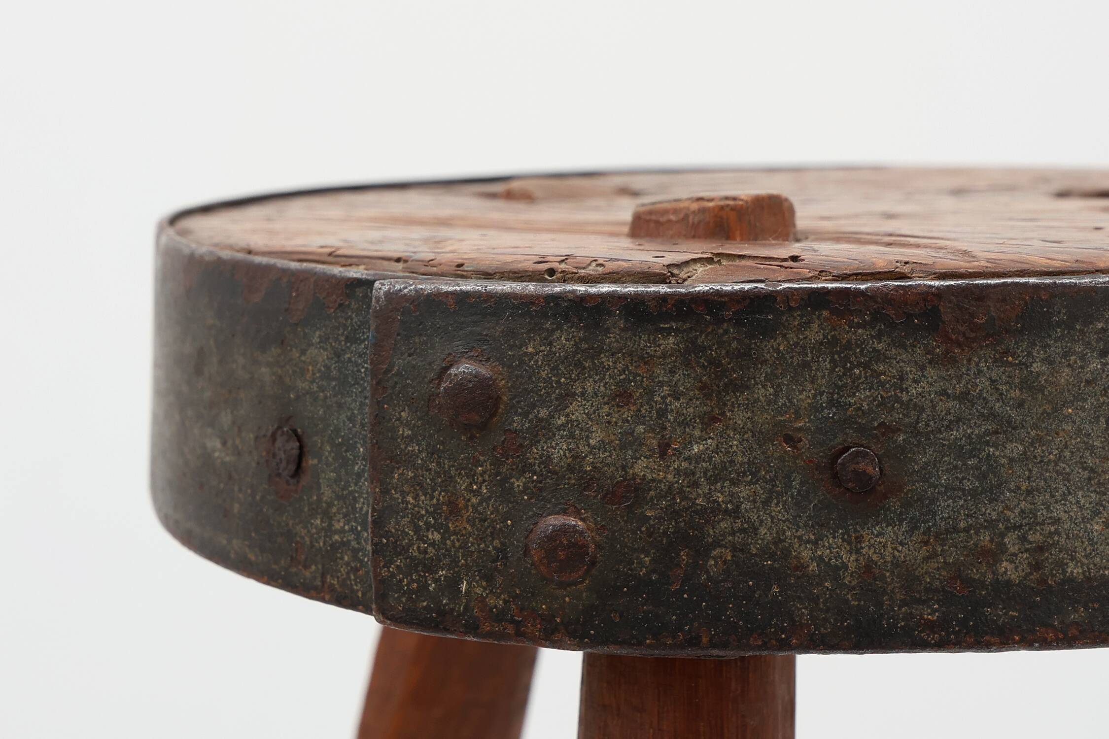 Brutalist French solid oak tripod stool with metal rim, 1850s