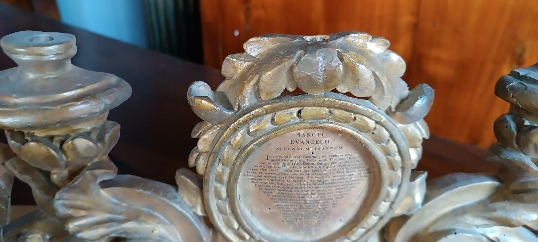 Ancient altar candlestick with gilded wooden cartagloria, 18th century.