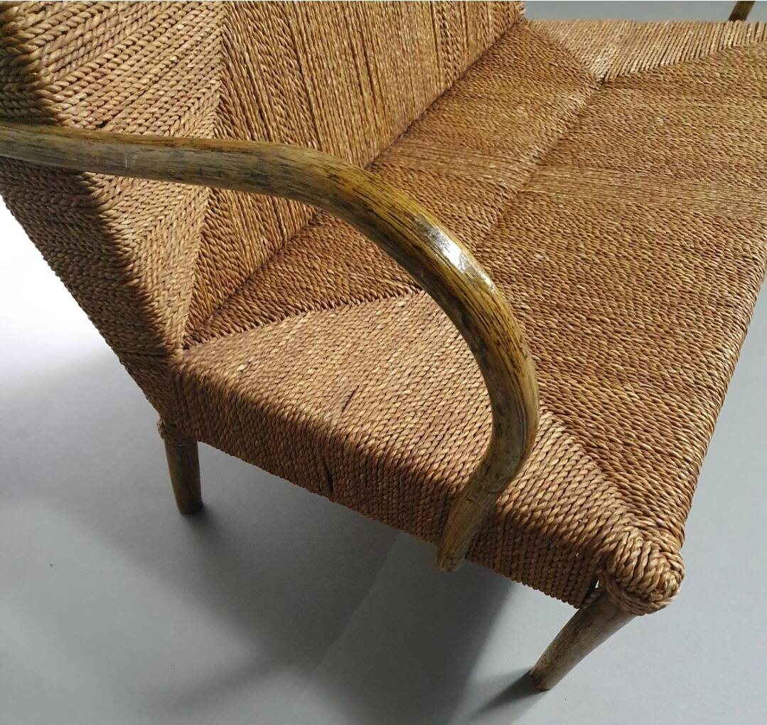 Vintage French papercord sofa with a metal frame base