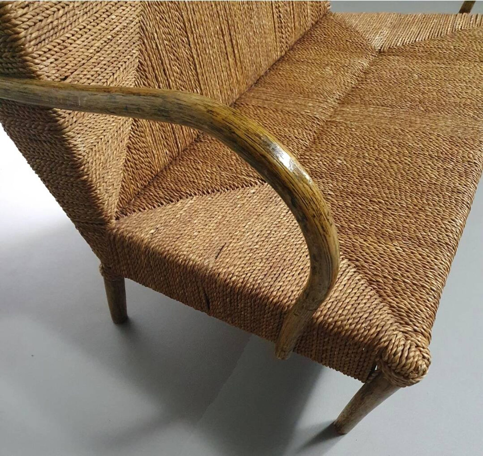 Vintage French papercord sofa with a metal frame base