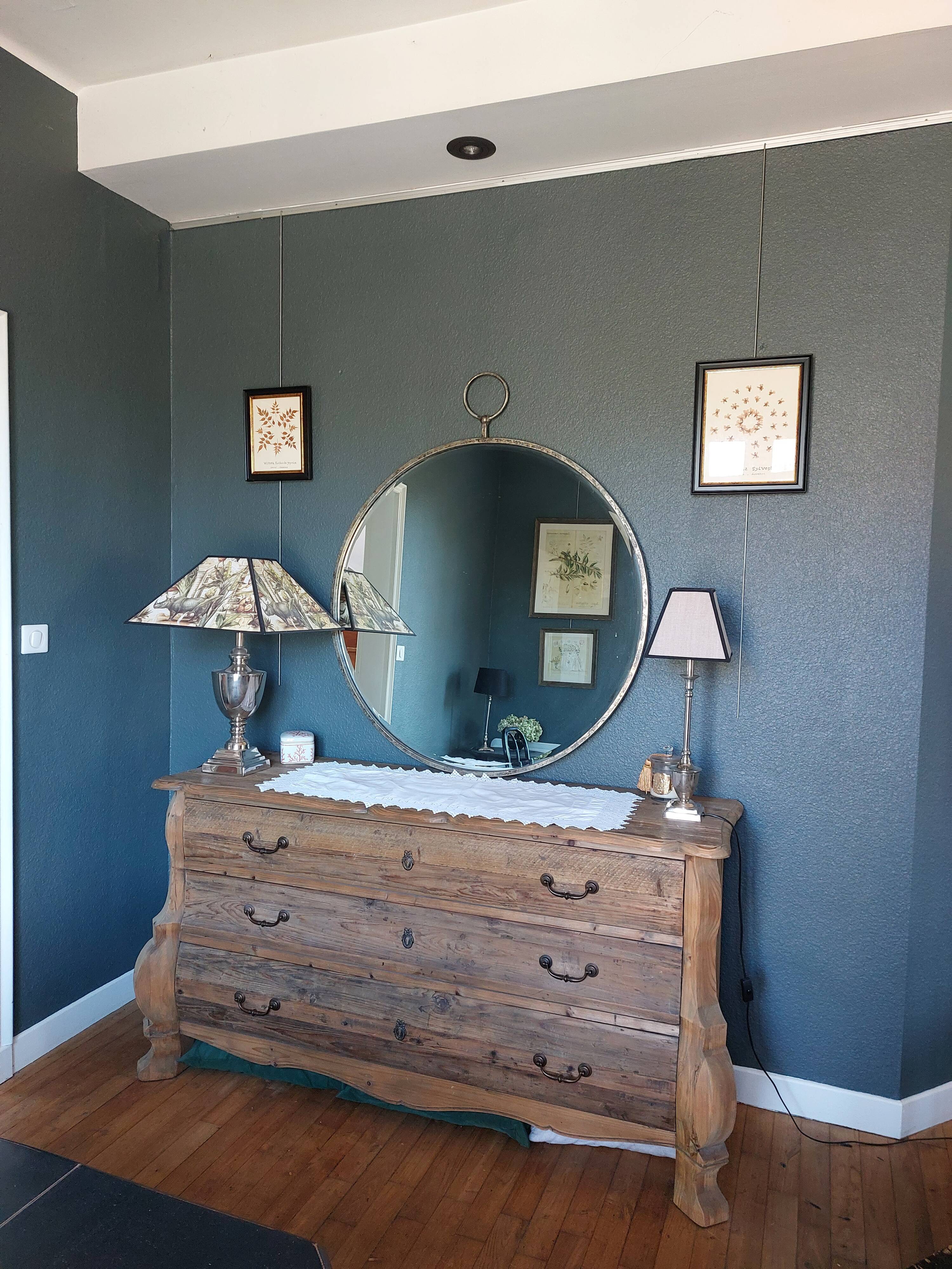 Round patinated mirror