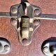 Brown vintage suitcase with CHENEY England brand travel tags