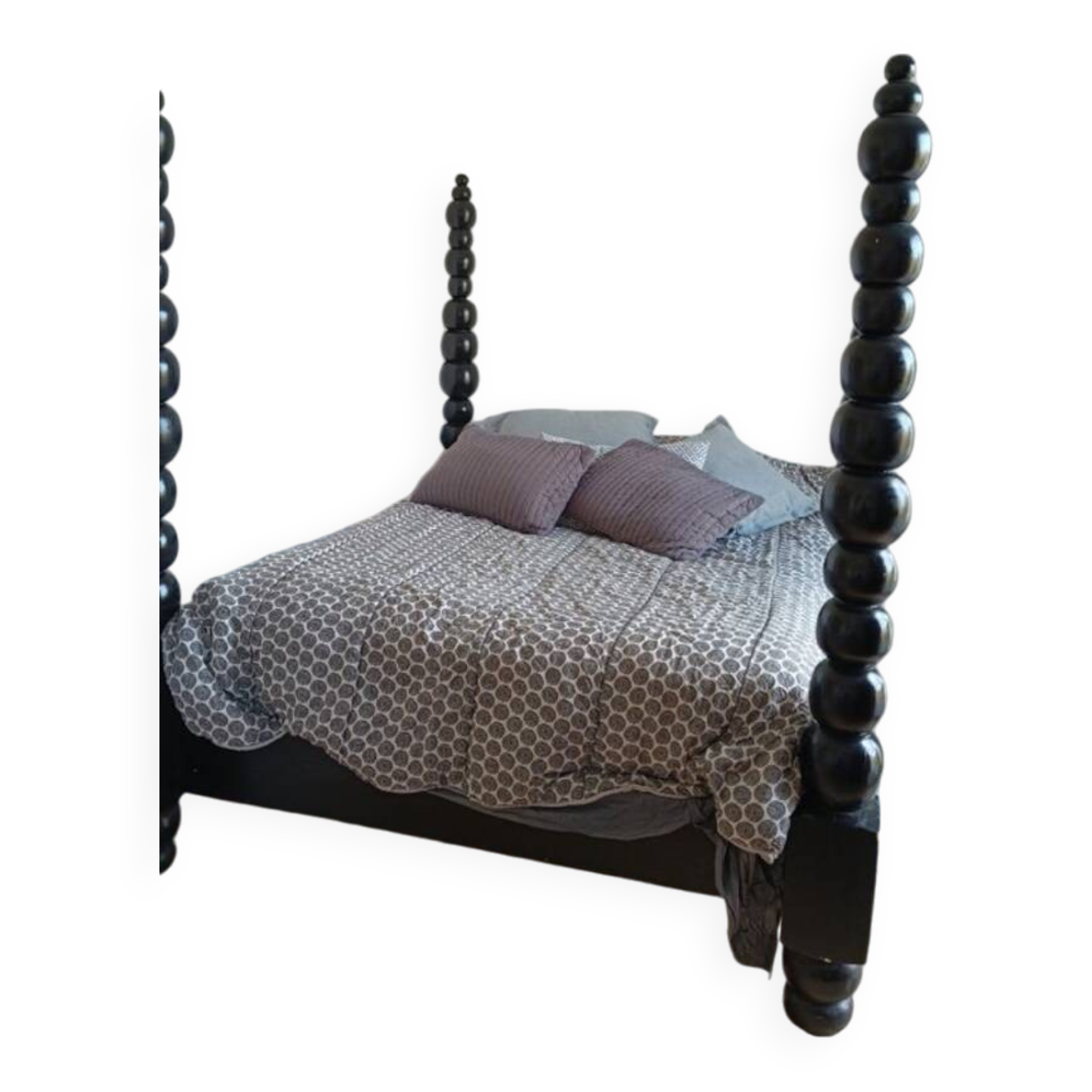 Black, solid wood four-poster bed, made by a craftsman in Mexico