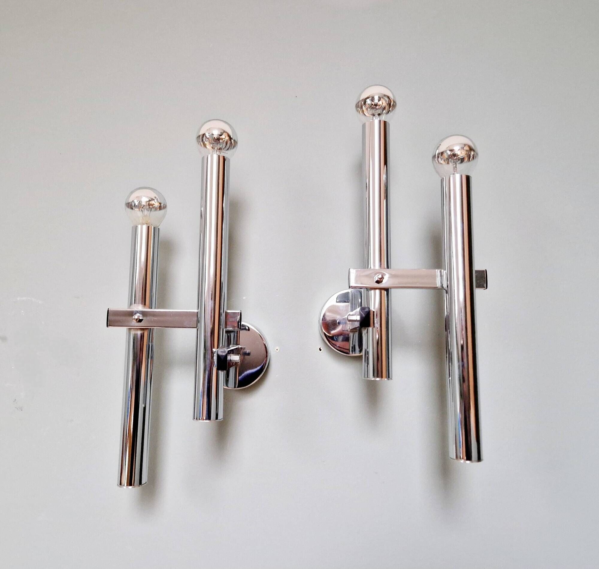 Pair of chromed metal wall lights, design Gaetano Sciolari, 1970s