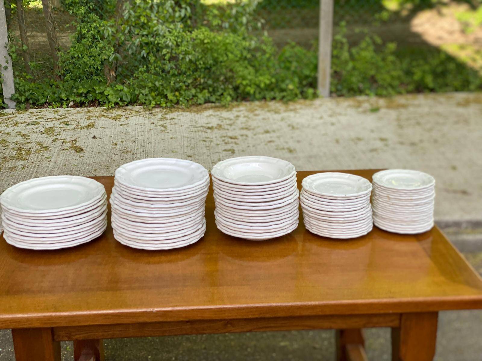 Service of 84 vintage white porcelain plates.