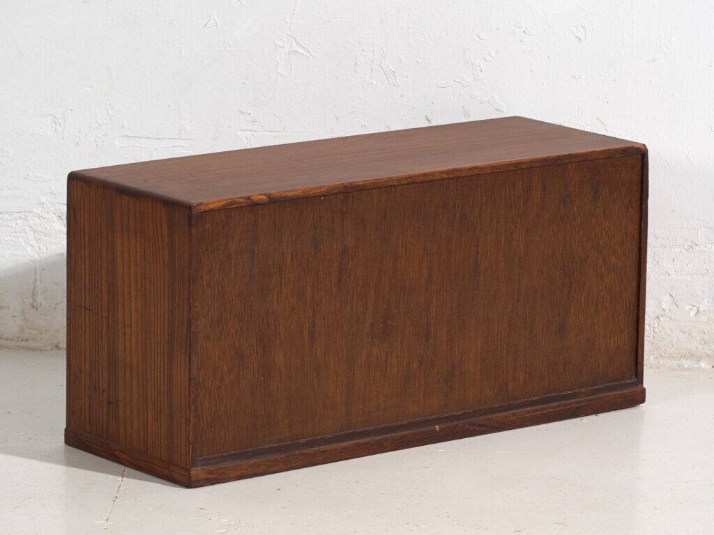 Small Japanese cabinet with sliding doors, Kabuki decoration, made of paulownia wood, early Showa period, circa 1926–1970.