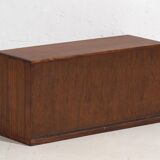 Small Japanese cabinet with sliding doors, Kabuki decoration, made of paulownia wood, early Showa period, circa 1926–1970.