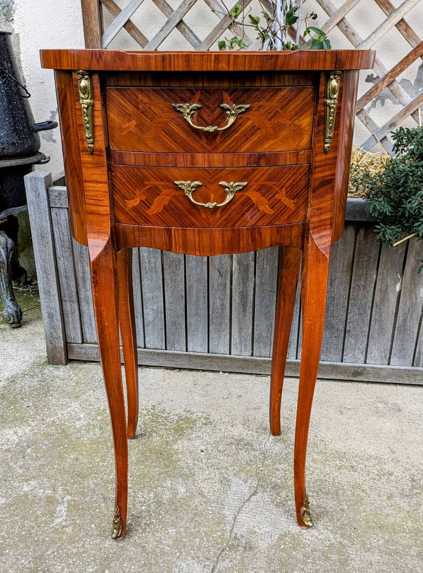 Old oval bedside table in rosewood marquetry Louis XV style