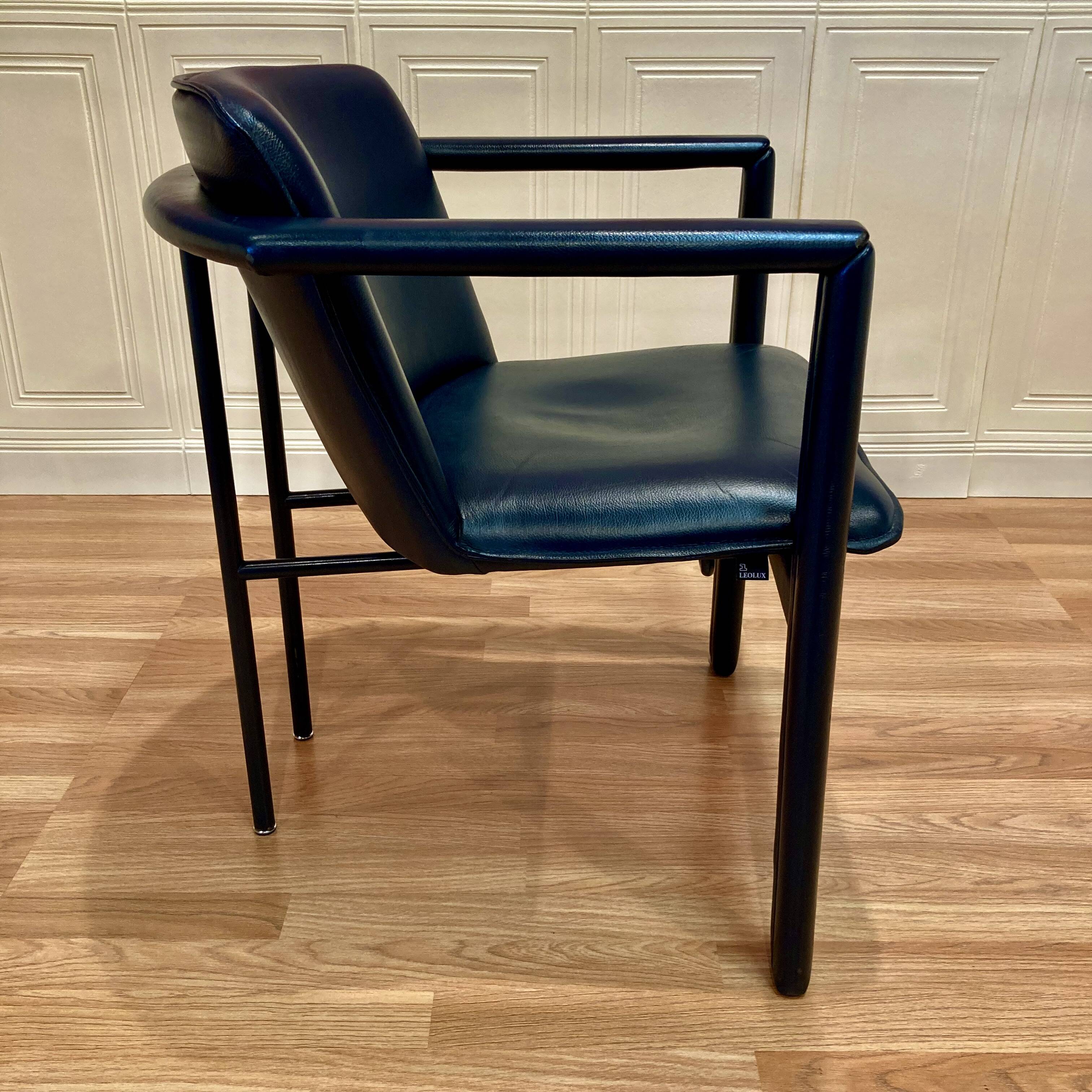 Set of 3 designer leather and metal armchairs.