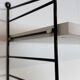 Vintage Nisse Strinning wall rack with 7 white shelves