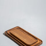 Trio of rounded rectangular trays or cups in monoxyl teak L:35