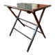 Folding mahogany table with a mirror top.