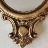 Classic Baroque/Louis XV style mirror. In old gold patinated wood. Palmette/Scroll/Blazon motif decor. Dim 46 x 27 cm