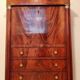 Empire secretary with openwork.