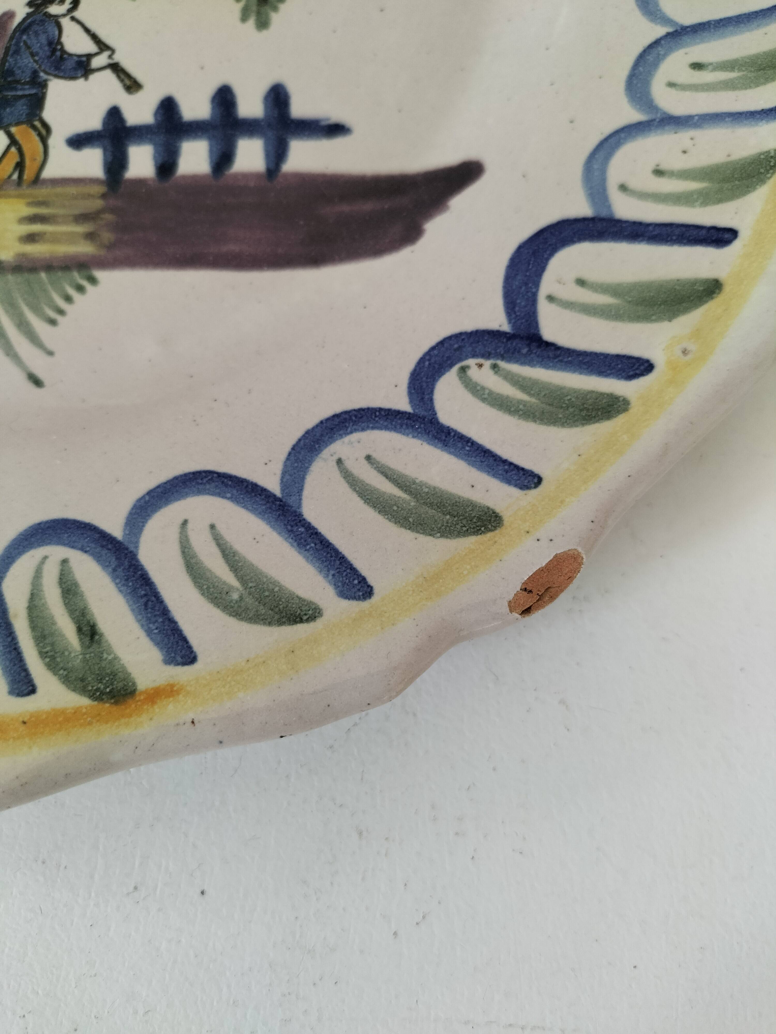Antique hand-painted earthenware plate – piper and birds