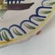 Antique hand-painted earthenware plate – piper and birds
