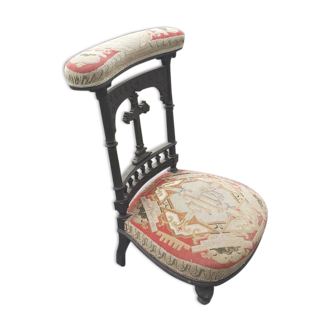 Pray god sitting and rests hands in tapestry