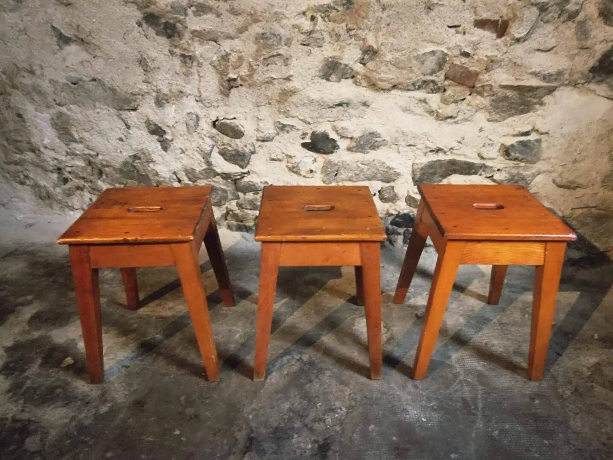Set of 3 vintage French wooden stools from the 1950s.