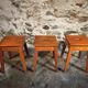 Set of 3 vintage French wooden stools from the 1950s.