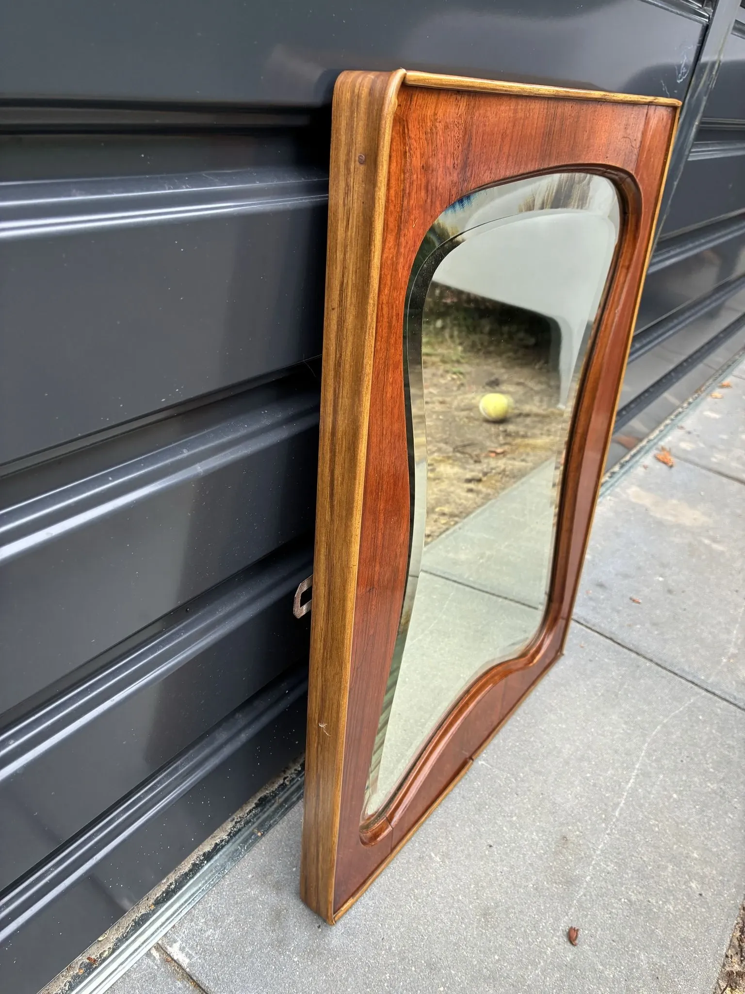 Mid-century organic shaped bevelled mirror in wooden frame, 1940s-50s