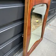 Mid-century organic shaped bevelled mirror in wooden frame, 1940s-50s