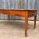 Antique cherry farmhouse table with 2 drawers and 1 pull-out