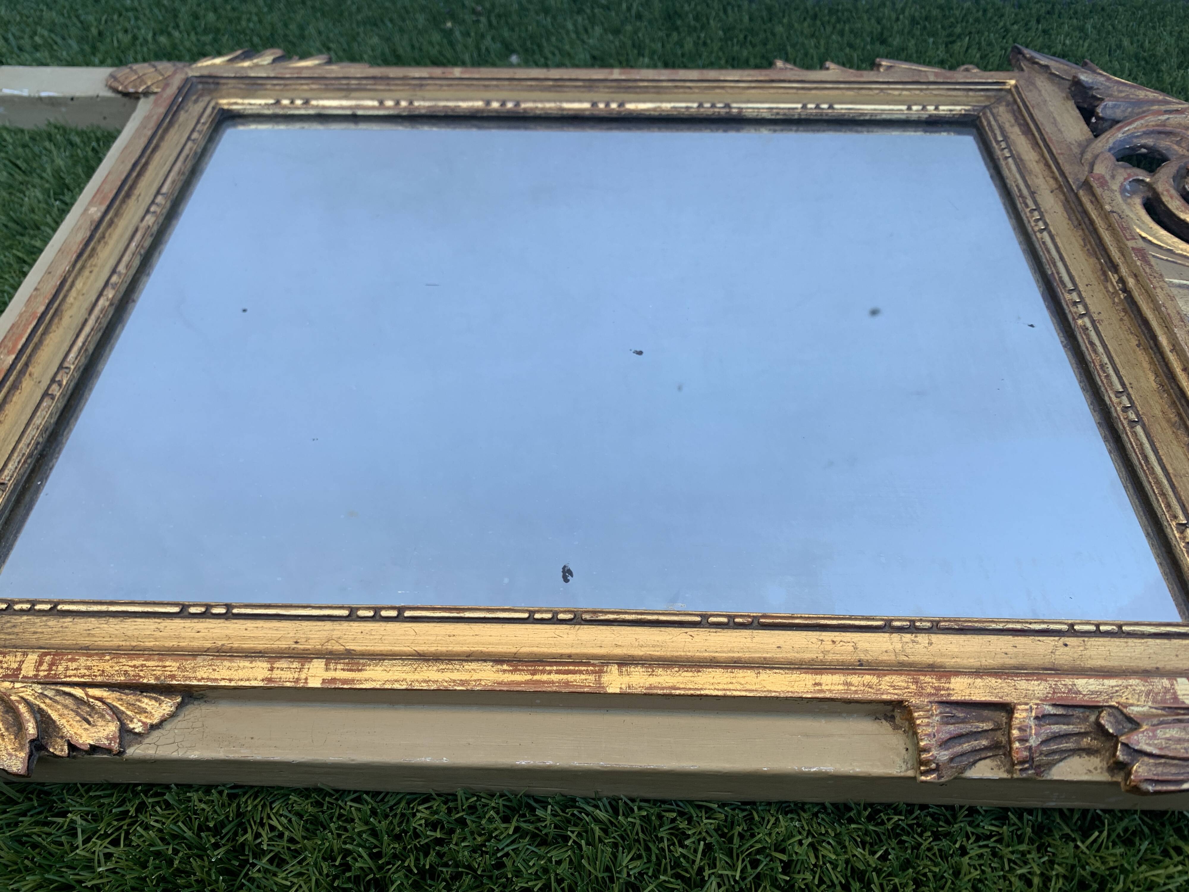 Antique mirror with gilded wood pediment, Louis XVI style