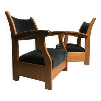 A pair of Amsterdam School lounge chairs.