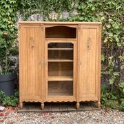 Asymmetrical Art Deco glass-fronted Parisian wardrobe in raw oak, 1930.