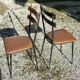 Pair of metal and imitation leather chairs 1950