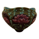 Old earthenware cachepot with flower decoration