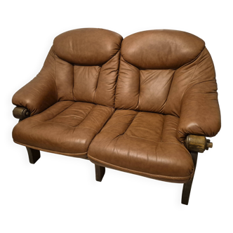 Vintage Scandinavian two-seater sofa in cognac leather and solid oak.