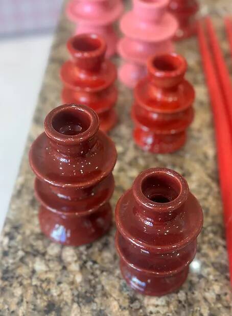 Red candlestick holder