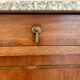 Antique bedside table in wood and marble – adorned with gilded brass ornaments –