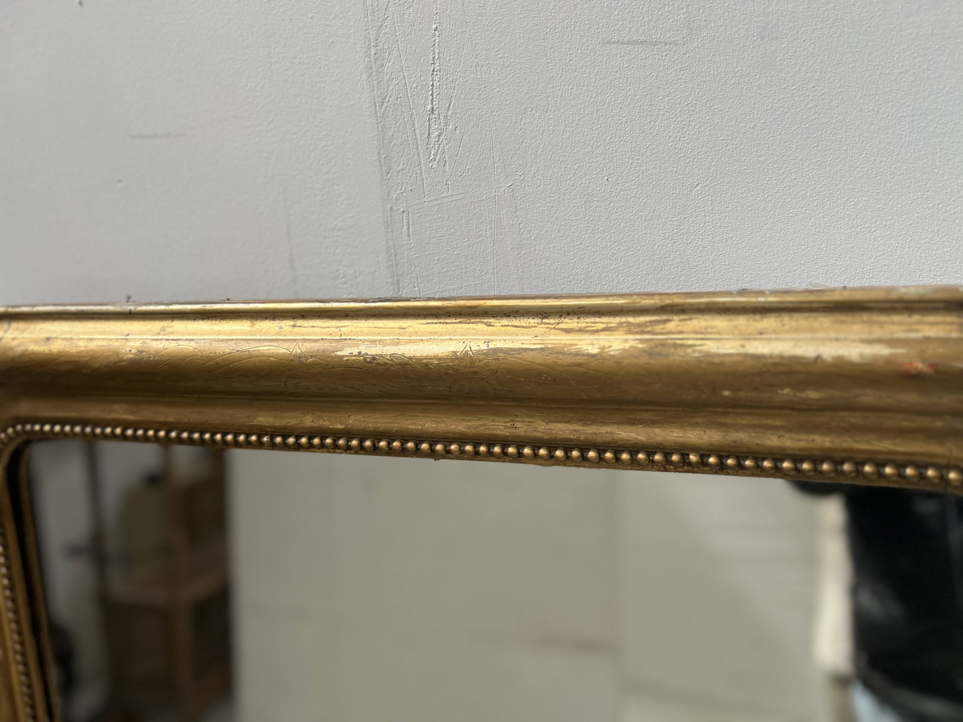 Louis Philippe mirror in wood and gilded stucco, 19th century