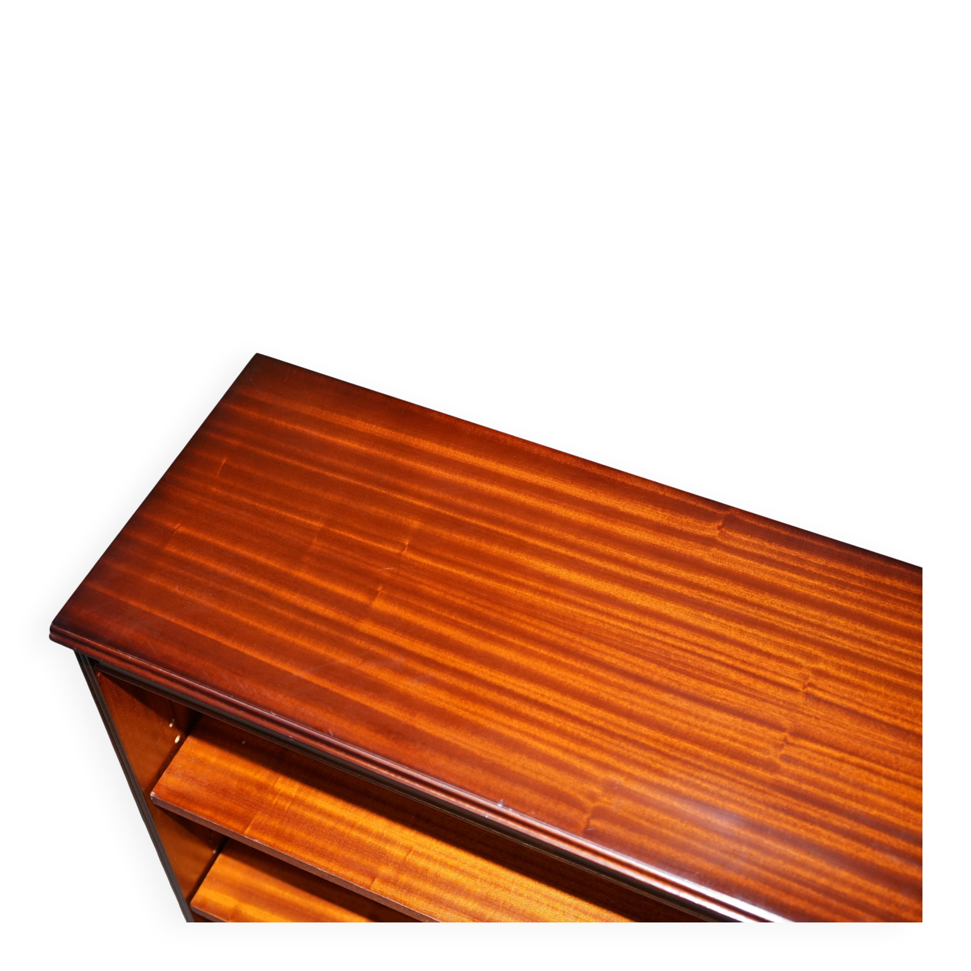 Pair of open low bookshelves Shaws of London in hardwood.