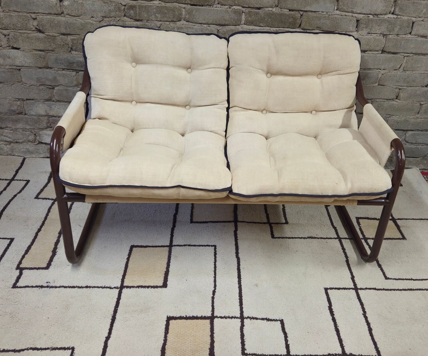 Tubular two-seater bench from the 1970s.