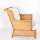 Large wicker armchair and its ottoman