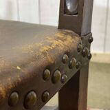 High-backed chair from the early 20th century in oak and leather