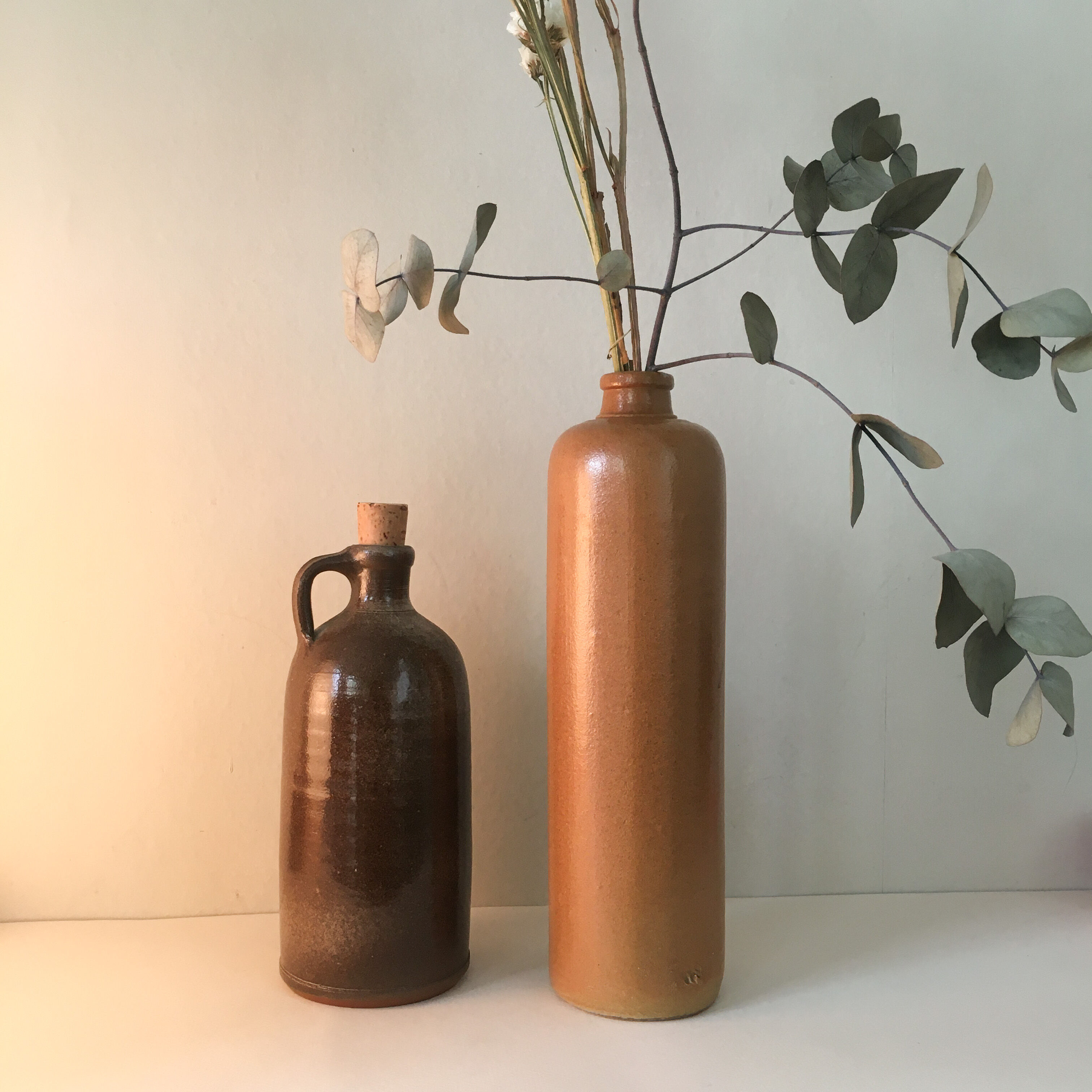 Duo of sandstone bottles