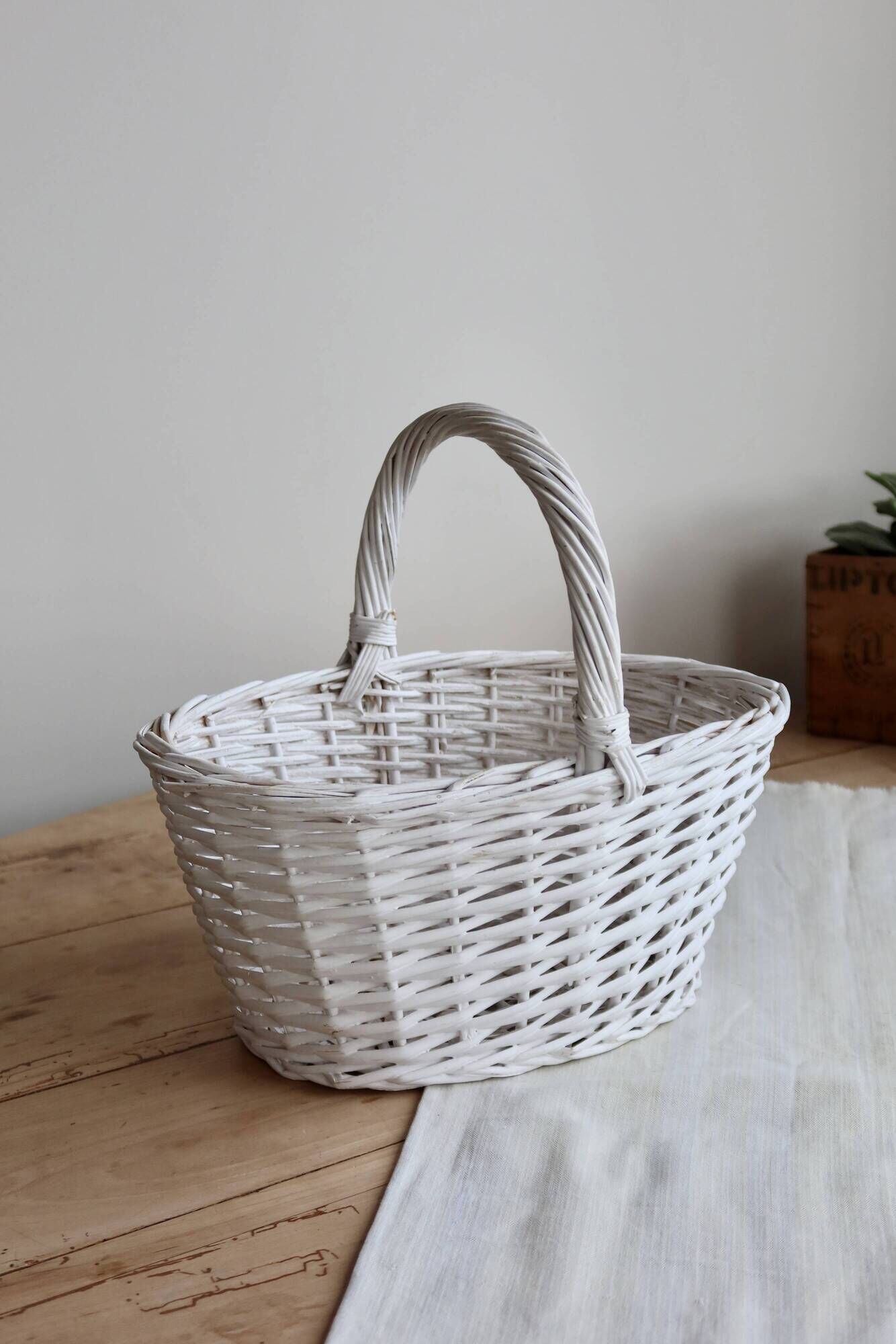 Vintage wicker basket painted white