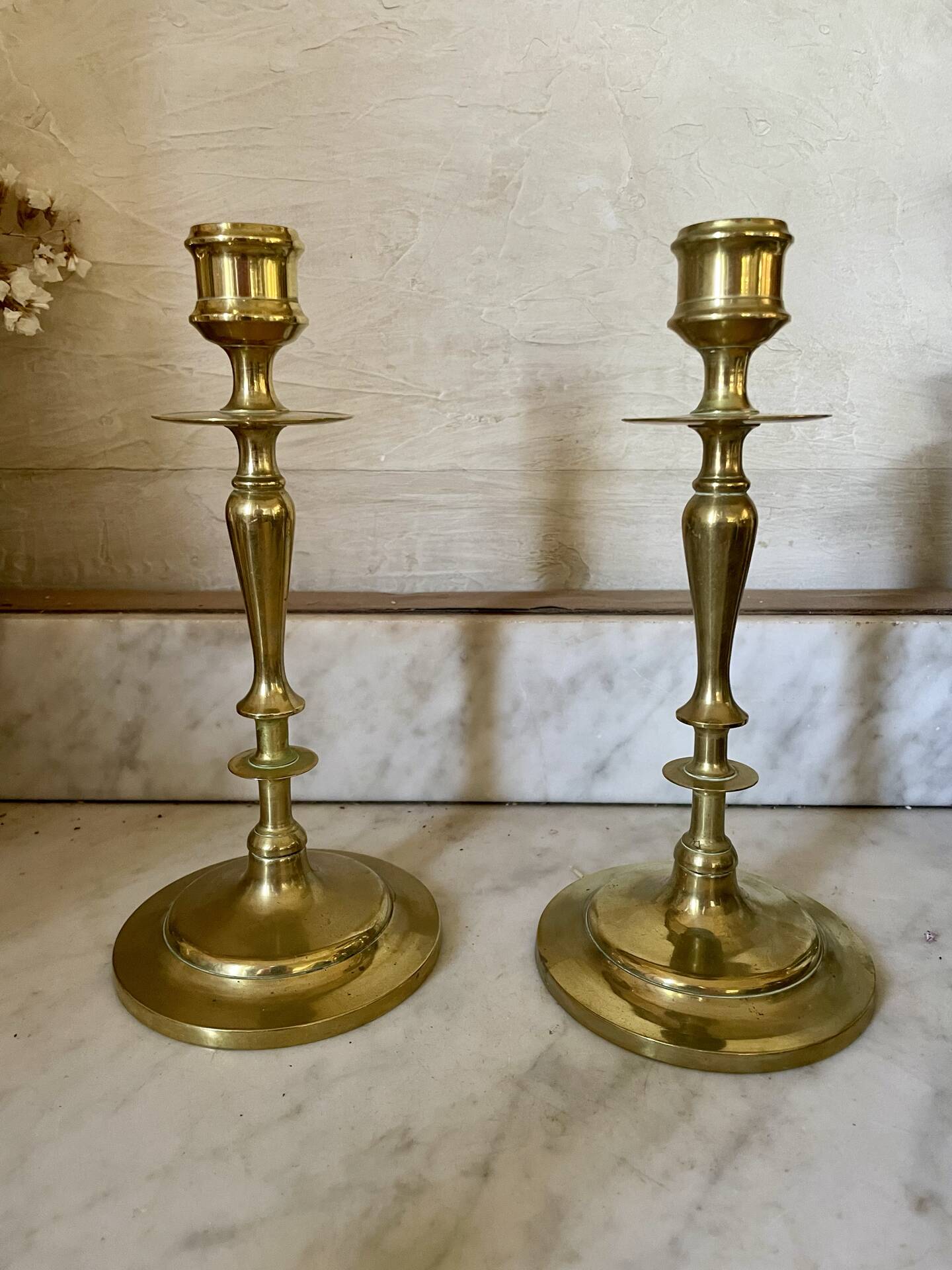 Old pair of turned brass candlesticks