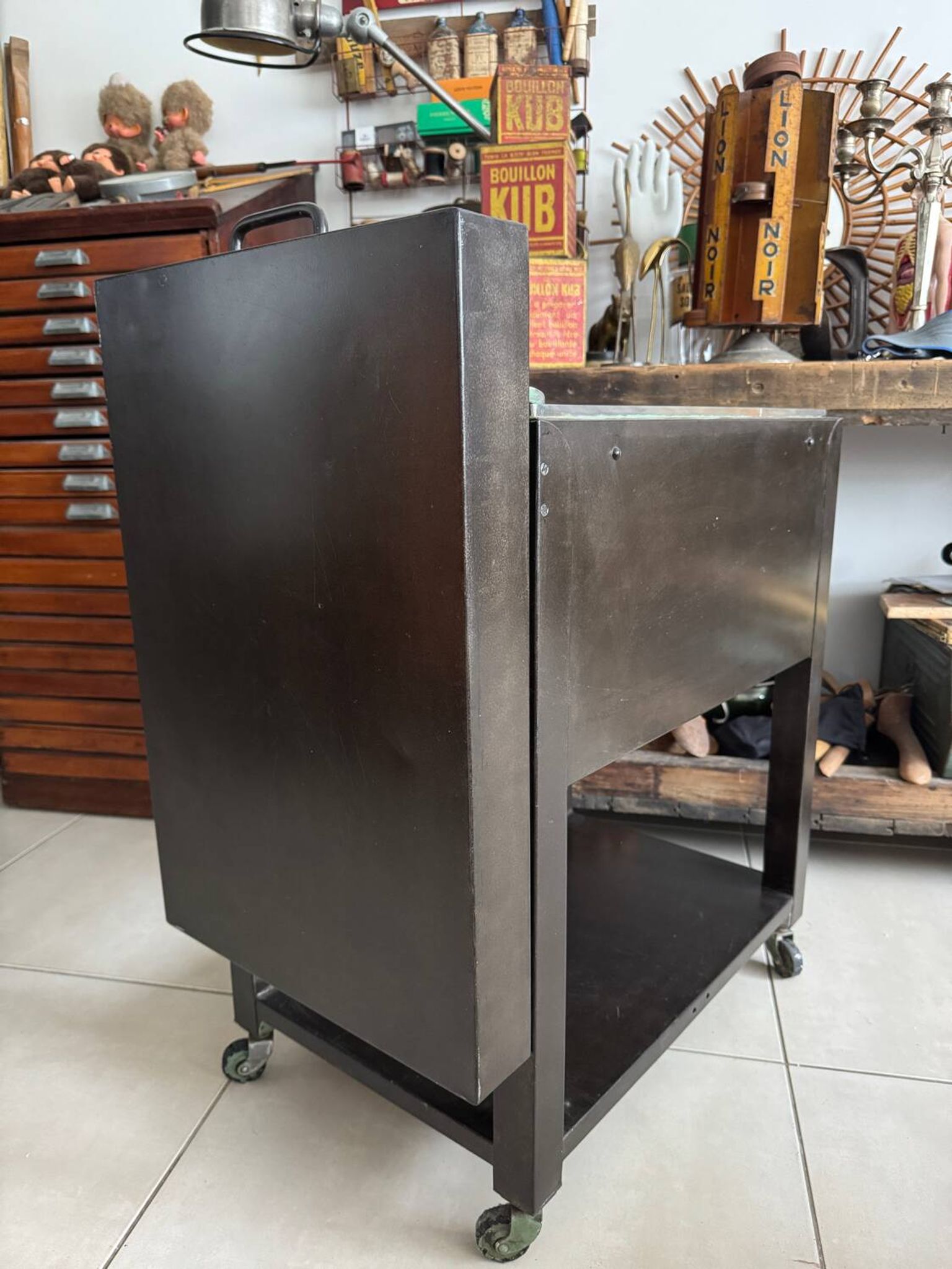 Vintage industrial filing cabinet on wheels