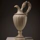 Carved alabaster urn lamp with stylized fish handle