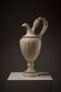 Carved alabaster urn lamp with stylized fish handle
